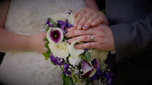 Wedding ring and bouquet captured by wedding videographer in south west