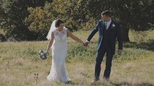 Bride and Groom romantic walk during wedding video to add those personal touches to their wedding day at Shilstone House, Plymouth