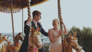 Bride and Groom in Torquay on a carousel to add person touches to their wedding day