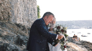 Bride & Groom opening champage on Salcombe beach a south west wedding venue