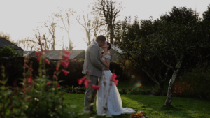 Couple kissing at their outdoor wedding ceremony