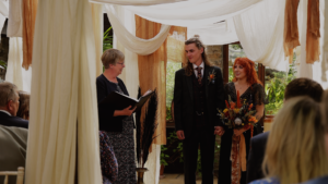 Couple during their wedding ceremony as wedding videographer and photographer work together to capture their day
