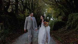 Couple walking at their outdoor wedding ceremony