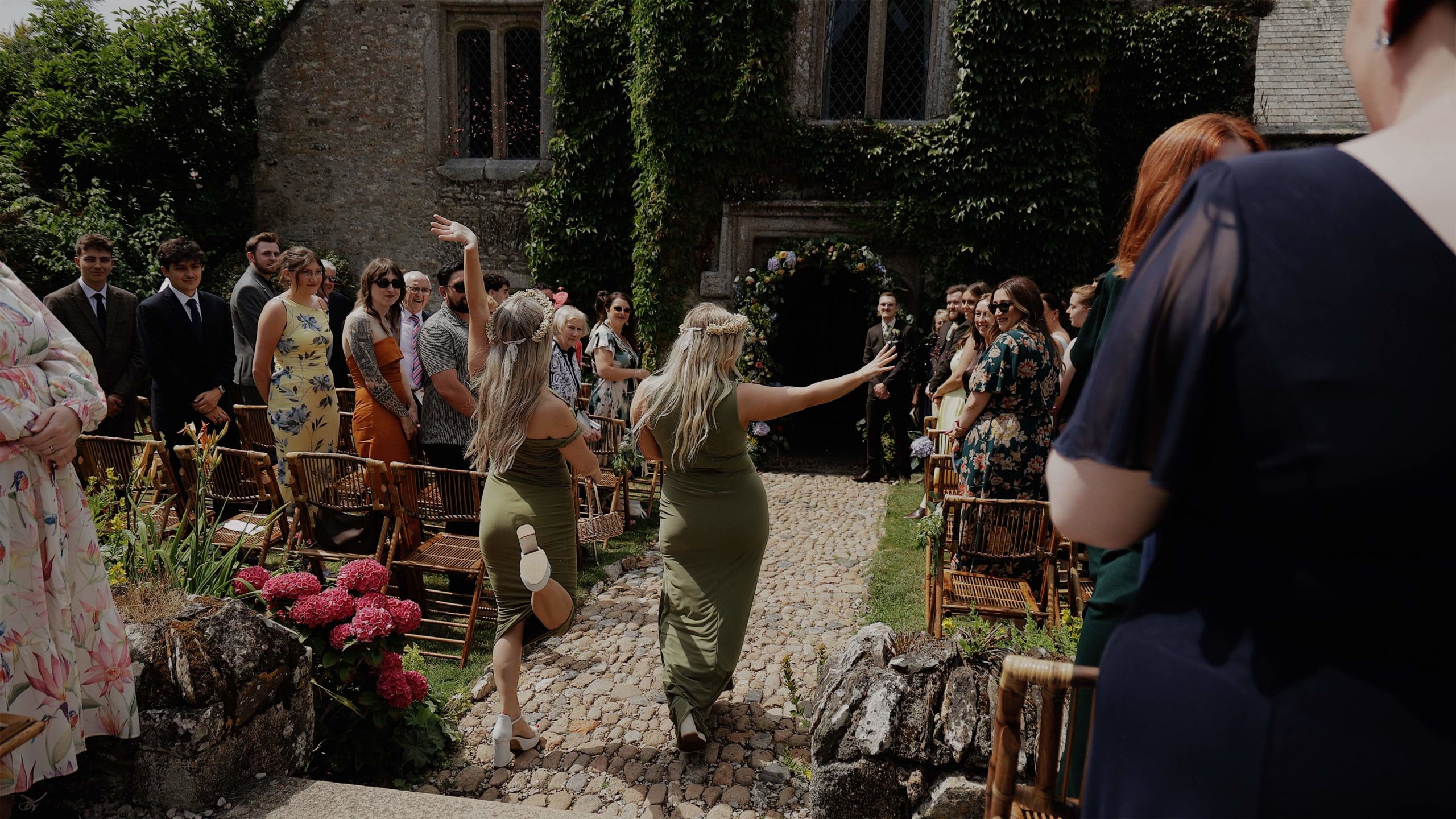 Beth & Calum - Hareston manor flower girls A bride and groom sharing a kiss on a carousel at Weymouth beach