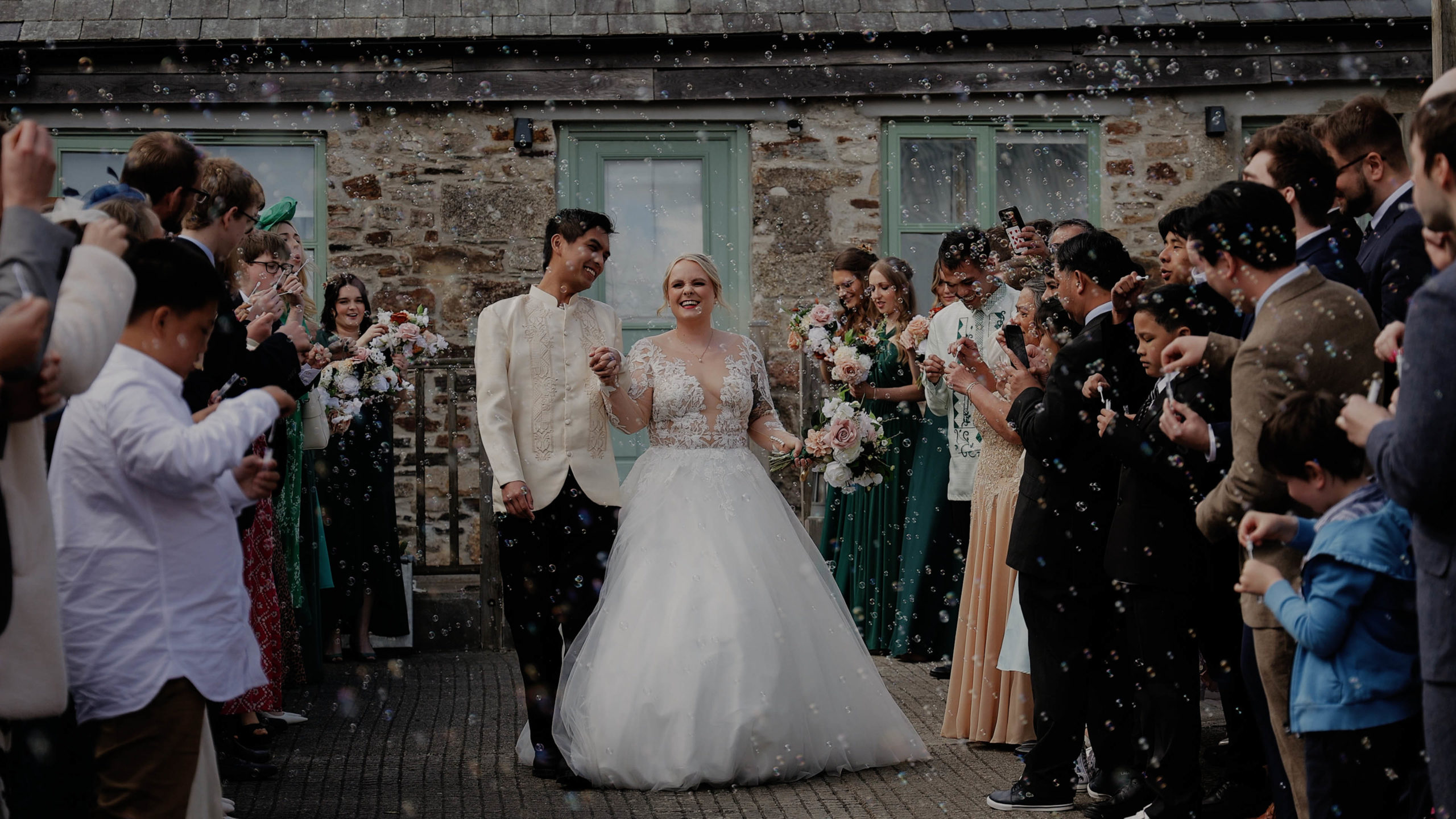 A non traditional bride & groom signing their marriage certificate at Westcott Barton