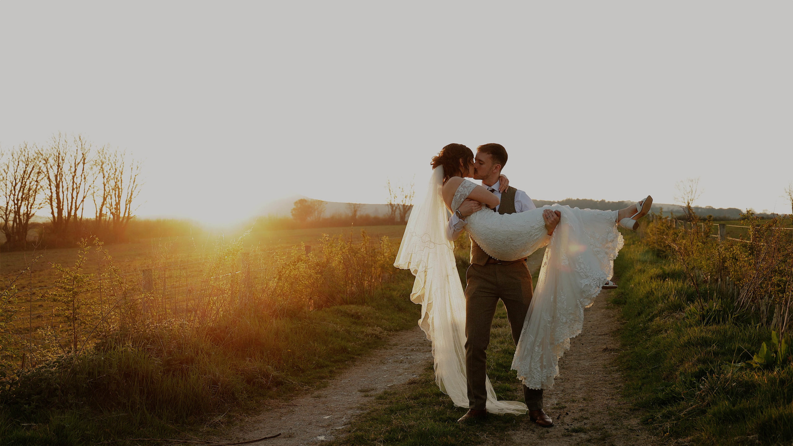 Georgia & Scott The Green sunset lift kiss A groom thrown in the air by his groomsmen at a wedding