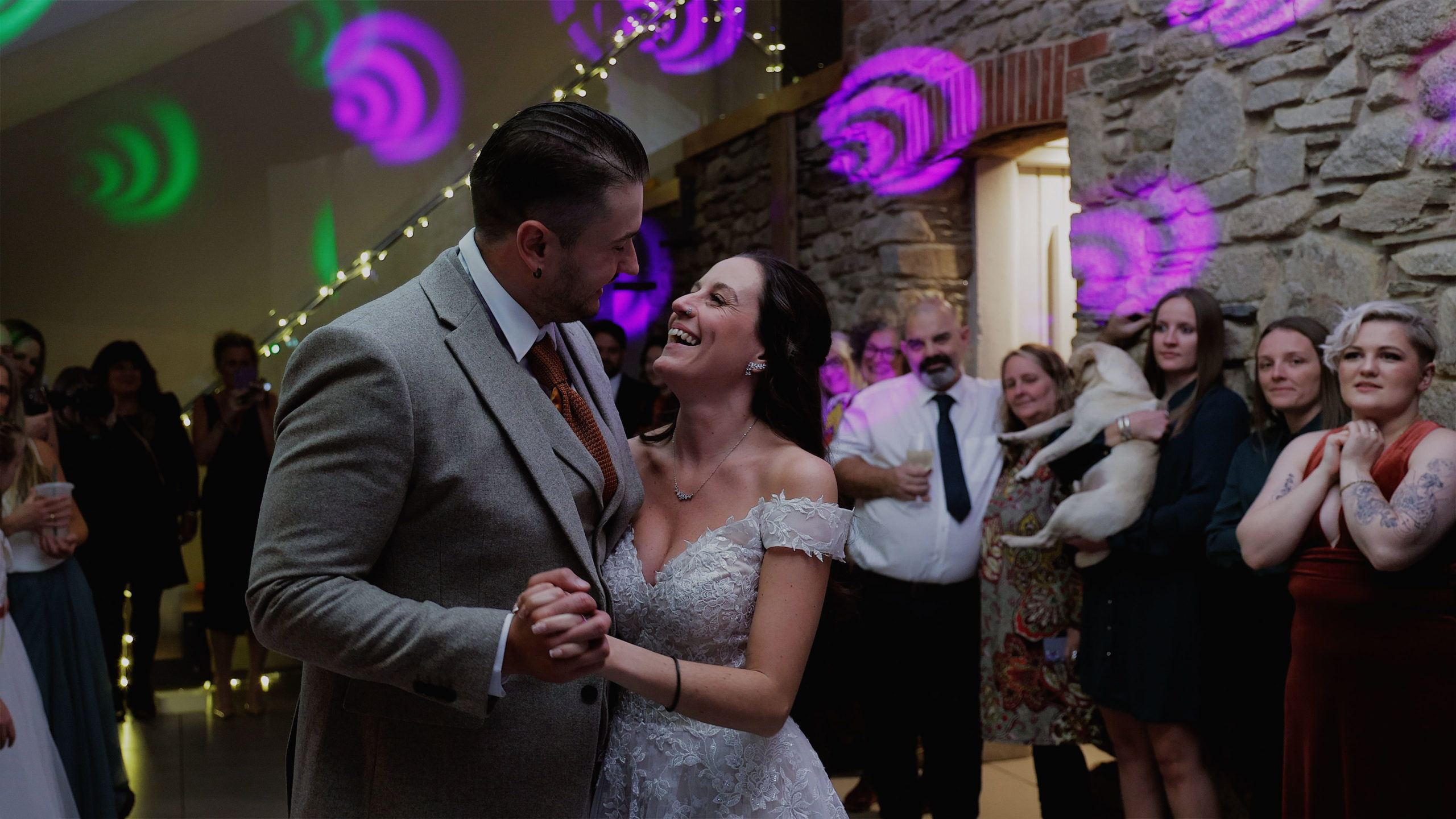Jess & Lucian - Trevenna Barn 14 A bride and groom having a race on a pair of orange space hoopers at Harefield Barn