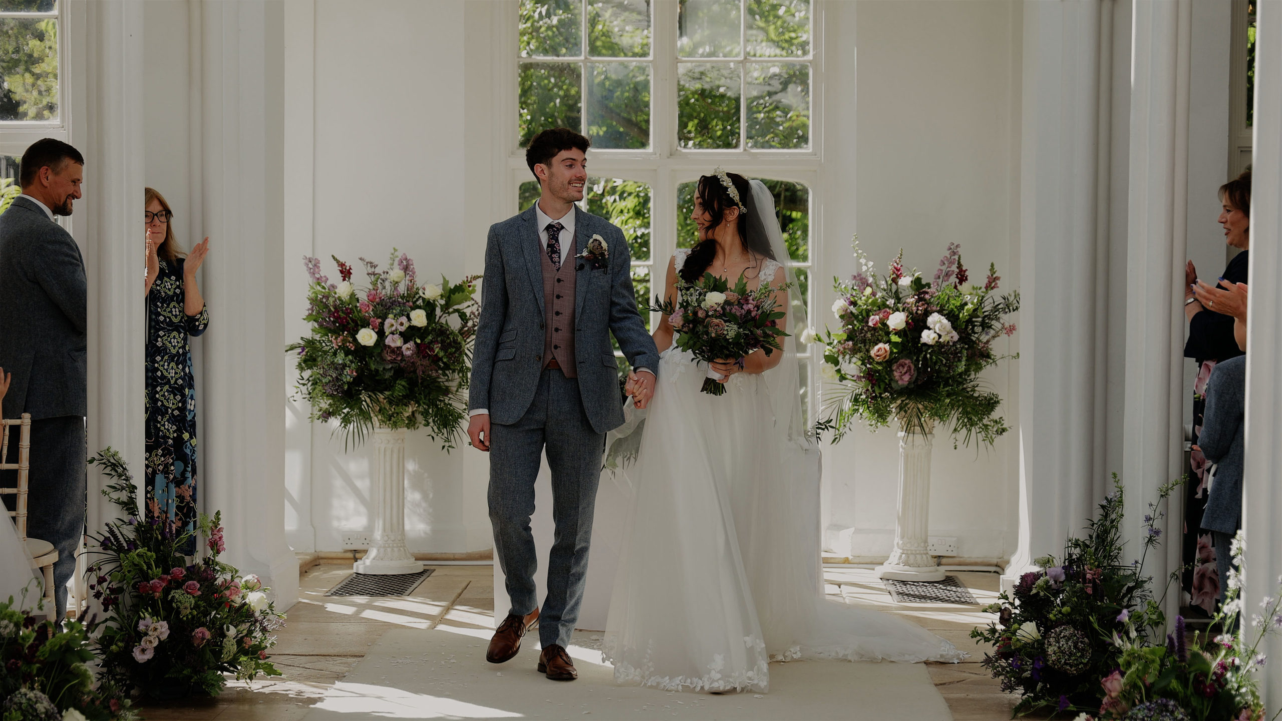 Lydia & Rhys st audries park ceremony exit A saxophone player playing live music for wedding guests at Mount Edgcumbe House